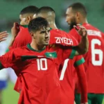 Football: Le Marocain Brahim Díaz célébrant les bras levés, représentant les Lions de l'Atlas officiellement sacrés champions de la CAN 2025 en mars 2026 suite à la décision controversée de la CAF d'annuler le résultat de la finale contre le Sénégal.